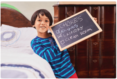 boy with chore chart